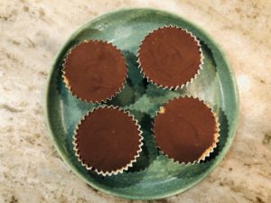 Small plate with four peanut butter cup candies 